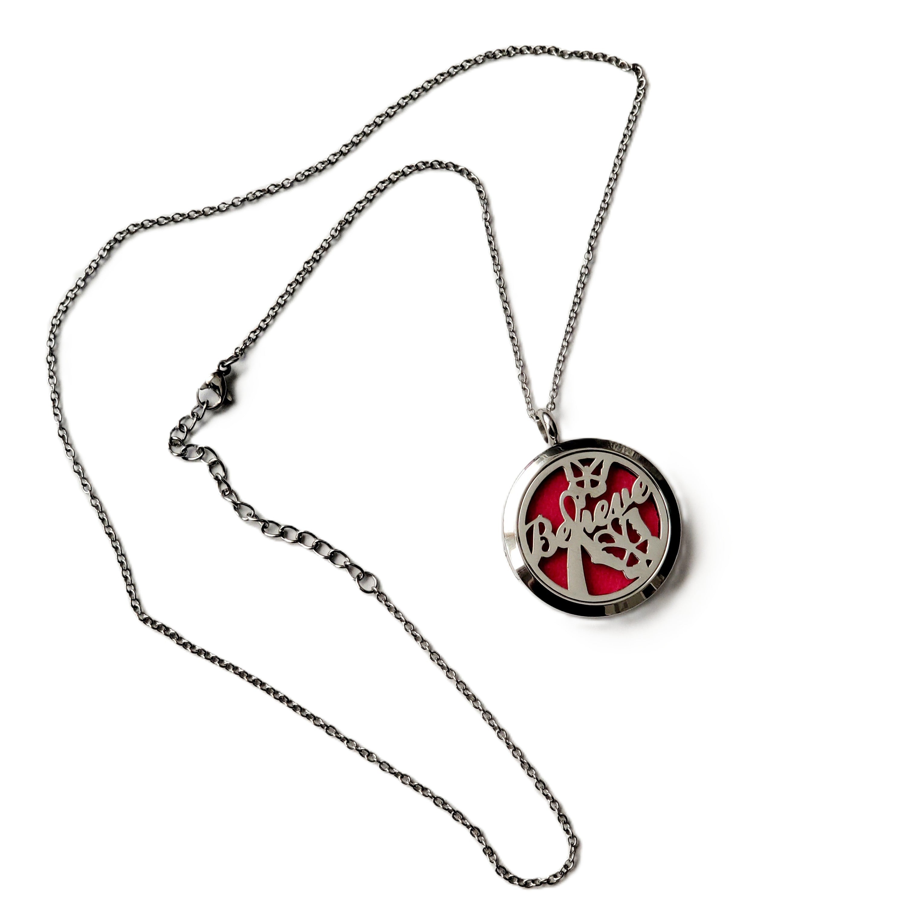 round silver pendant on a 10 inch silver chain necklace with Believe on pendent 